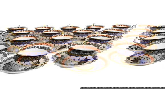 18 Royal Crown Derby England Porcelain Cup and Saucers in Quail 20th Century: 18 Royal Crown Derby England Porcelain Cups and Saucers in Quail, Late 20th Century. Rust red and gold feathered rim with a blue and gold blue quail feathered emblem to center. Royal Crown Derby marks