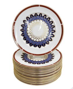 18 Royal Crown Derby England Porcelain Charger or Service Plates in Quail 20th C: 18 Royal Crown Derby England Porcelain Charger or Service Plates in Quail, Late 20th Century. Rust red and gold feathered rim with a blue and gold blue quail feathered emblem to center. Royal Crown De