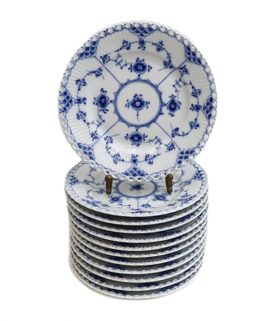 12 Royal Copenhagen Porcelain Bread Plates Blue Fluted Full Lace #1088 Mid C.: 12 Royal Copenhagen Denmark porcelain bread plates in blue fluted full lace #1088, Mid Century. Fluted porcelain with a delicate blue floral design. Full lace border to the rim. Underside with Royal C