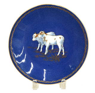 Wedgwood England Porcelain Powdered Cobalt Blue Gilt Plate Calves circa 1900: Wedgwood England Porcelain powdered cobalt blue and gilt 8.9 inch plate, circa 1900. Powdered cobalt blue ground with a pair of white and gilt calves to center. Wedgwood England mark to underside. Wei