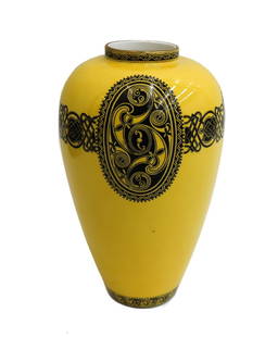 Wedgwood England Porcelain Yellow Black Celtic Vase c1900 Daisy Makeig Jones: Wedgwood England porcelain yellow and black Daisy Makeig Jones celtic vase, circa 1900. Yellow ground with black celtic designs to circular band. Wedgwood England mark to underside. Weight: Approx. 1
