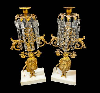 French Pair of Girandole Gilt Bronze Figural Candlesticks: Pair of Girandole Gilt Bronze Figural Candlesticks, with crystal prisms, marble base. Figure is a woman dressed in armor, holding a dagger and a sword. 11.4lbs Measures Approx.,17.25 inches height x 6