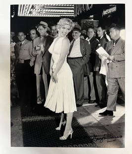 Black and White Photograph Marilyn Monroe Seven Year Itch George Barris: A limited edition George Barris photograph of Marilyn Monroe. Signed by George Barris in marker (lower right). Stamped and numbered on reverse. An iconic image of Monroe in a white dress, standing ove