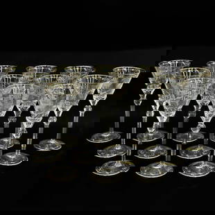 12 Moser Czech Cut Crystal Gilt Glass Water Goblets in Paula: 12 Moser Czech cut crystal glass water goblets in Paula . Gilt intaglio engraved floral decoration to rim and foot. Multi-sided knobbed stem. Acid etched "Moser" to base. Weight: Approx. 7.5 lbs Measu