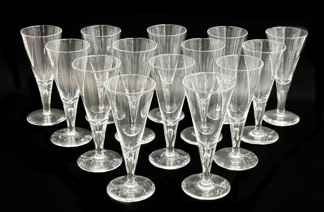 14 Steuben Bubble in Stem Glass Water Goblets #7924: 14 Steuben Bubble in Stem Glass Water Goblets #7924. Clear fluted glasses with bubbles within the stem. Underside of glasses signed Steuben, 3 glasses signed "S". With dust bags and two Steuben boxes.