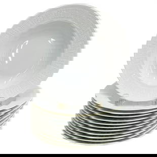 12 Hermes Paris Porcelain Rimmed Soup Bowls in Egee White: 12 Hermes Paris Porcelain Rimmed Soup Bowls in Egee. White porcelain plates, raised geometric decoration to the edge. Underside marked Hermes Egee. Weight: Approx. 9.5 lbs Measurements: Approx. 8.75 i