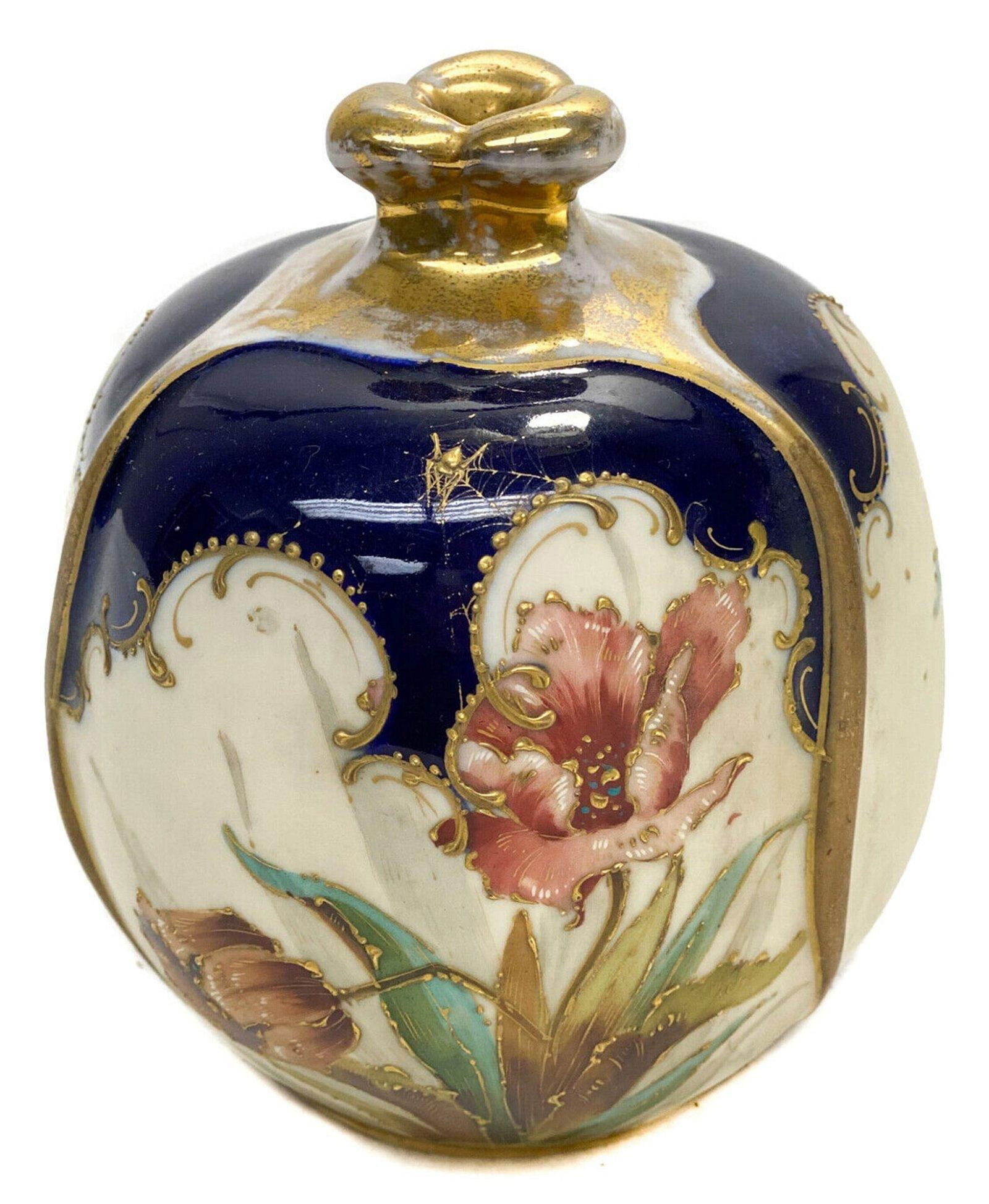 Amphora RSTK Pottery Vase. Spider Web And Flowers: Amphora RSTK Pottery round vase, circa 1900. A cobalt blue and peach ground with hand painted flowers throughout. Gilt foliate scroll and beaded accents with a gilt spider to the upper center, the gil