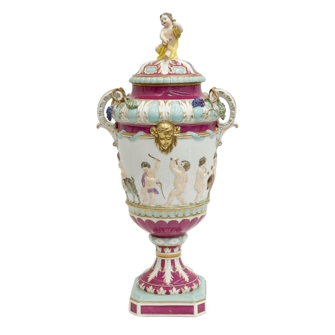 KPM Berlin Hand Painted Porcelain Covered Urn Putti 19th century: KPM Berlin Hand Painted Porcelain Covered Urn, 19th century. In the style of Capodimonte Pink and blue decoration with gilt accents, raised celebrating putti to the body, putti to the lid. Raised grap