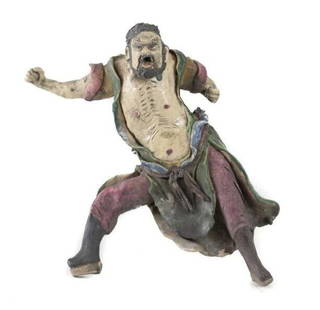 Chinese Shiwan Pottery Roof Figure Guardian glazed bearded man: Chinese Shiwan Pottery Roof Figure Guardian, glazed bearded man, bared chest, dynamic pose, glazed in green, red, blue. Reverse side shows this piece was once mounted to another tile or building. 2lbs