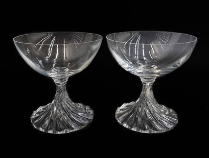 Pair Lalique France Crystal Glass Champagne Saucers in Rambouillet: Pair Lalique France Crystal Glass Champagne Saucers in Rambouillet. Clear bowl with a twisted flare stem. Signed "Lalique France" to underside. Weight: Approx. 1 lb Measurements: Approx. 4.125 inches