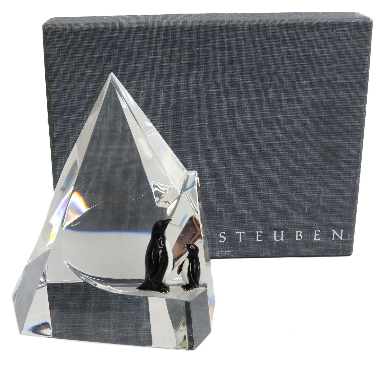 Steuben - Penguin Floe -by George Thompson 1970: Steuben cut glass Penguin Floe Glass sculpture by George Thompson, circa 1970. The sculpture depicts a cut glass crystal to resemble an ice berg with two figural penguins made out of black enamel, yel