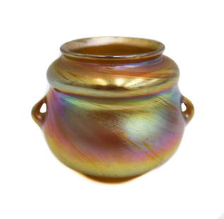 LCT Tiffany Gold Favrile Blue Pink Iridescence Art Glass Twin Handled Vase 4221G: L.C.T. Louis Comfort Tiffany gold Favrile twin handled round art glass vase, #4221G circa 1900. Gold favrile with blue and pink iridescent hues. Underside marked LCT #4221G Weight Approx.0.5 lb Measur