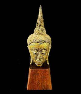 Gilt Bronze Ayutthaya Thai Buddha head fragment, mounted on a wood plinth: Gilt Bronze Ayutthaya Thai Buddha head fragment, c18th-19th Century. Likely gold leaf on copper. 1.3lb Measurements: Approx.head only 5.75 inches height x 2.5 x 2.25 inches. Total 7.5 inches height Do