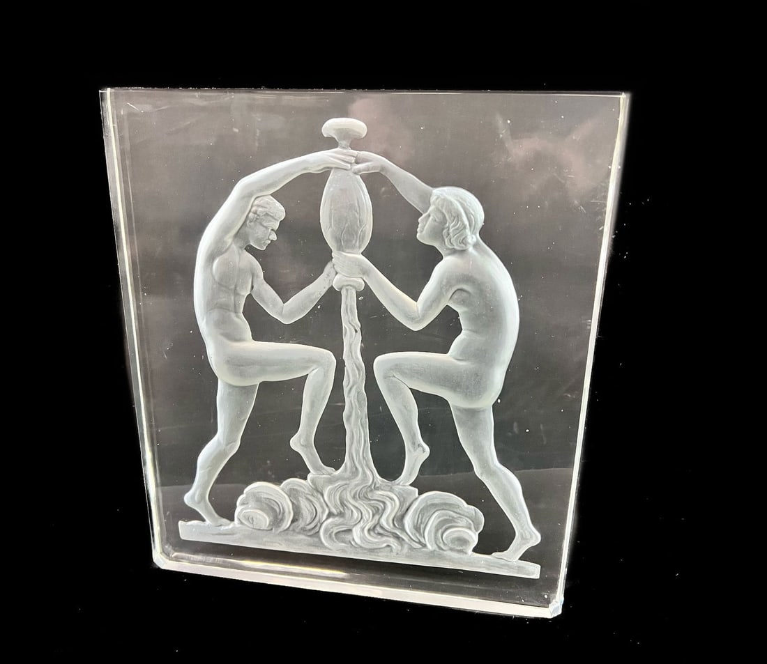 Steuben Glass Art Deco Luminaire Panel: Steuben Glass Art Deco Luminaire Panel. Thick glass panel with frosted reverse relief design of man and woman. No lamp base. 5lbs Measures Approx. 9.5 x 11 x 1 inches Domestic Shipping: $50