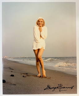 Color Photograph Marilyn Monroe by George Barris: A limited edition George Barris color photograph of Marilyn Monroe. Signed by George Barris in marker (lower right). Stamped and numbered on reverse. Marilyn Monroe at Santa Monica Beach in 1962, dres
