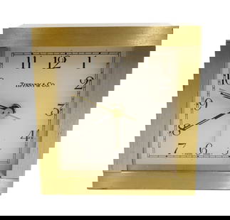 Tiffany & Co Square Brass Desk Clock Swiss Quartz Made: Tiffany & Co square brass desk clock swiss made. Marked Tiffany & Co. and Swiss Made to face. The back marked Swiss Quartz with a stop/push/pull buttons. Weight: Approx. 2 lbs Measurements: Approx. 3.