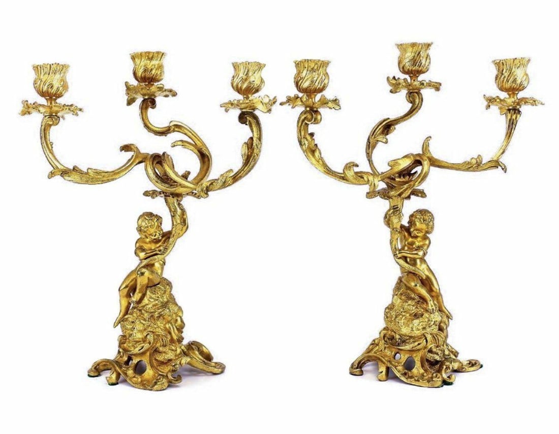 Pair French Antique Gilt Bronze Angels or Putti Candelabra Chandeliers 19th C: Pair of Putti French Gilt Bronze candlesticks, late 19th or early 20th century. beautiful raised partially clad Putti Figure entangled in a nest of leafy parchments. Unmarked. Weight of 10 pounds. App