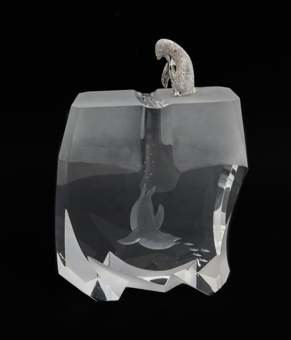 Steuben Glass Sculpture - Ice Penguin - by James Houston Signed: Steuben Glass Sculpture - Ice Penguin - by James Houston Signed. The glass sculpture depicts a silvered penguin looking down an ice floe to an etched swimming penguin eating a school of fish. Steuben