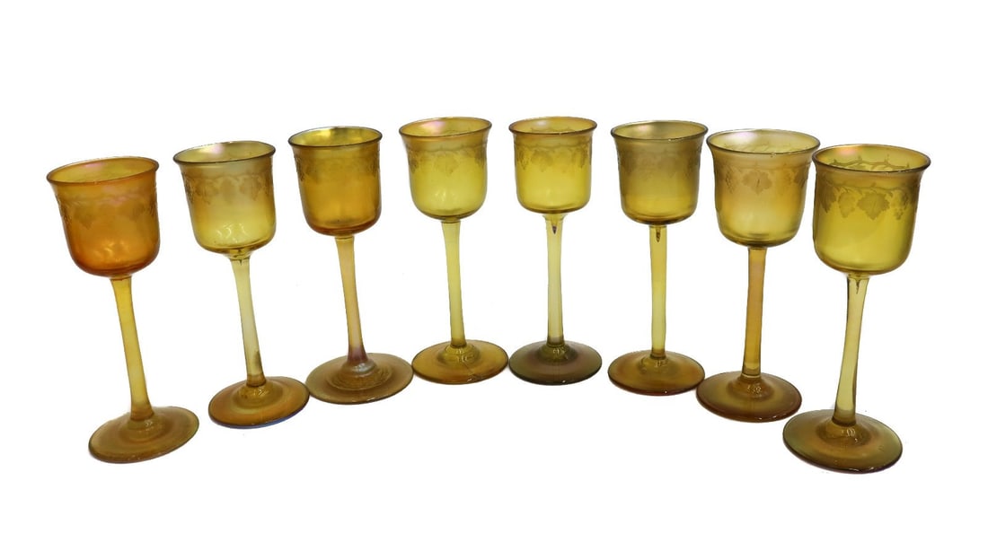 8 LCT Tiffany Favrile Iridescent Gold Art Glass Wine Liquor Goblets Signed c1900: 8 LCT Tiffany Favrile Iridescent gold art glass wine liquor goblets, signed 1900. Etched grapes to circular bands. Marked "LCT" to pontil undersides. Weight: Approx. 1 lb Measurements: approx. 1.5 inc