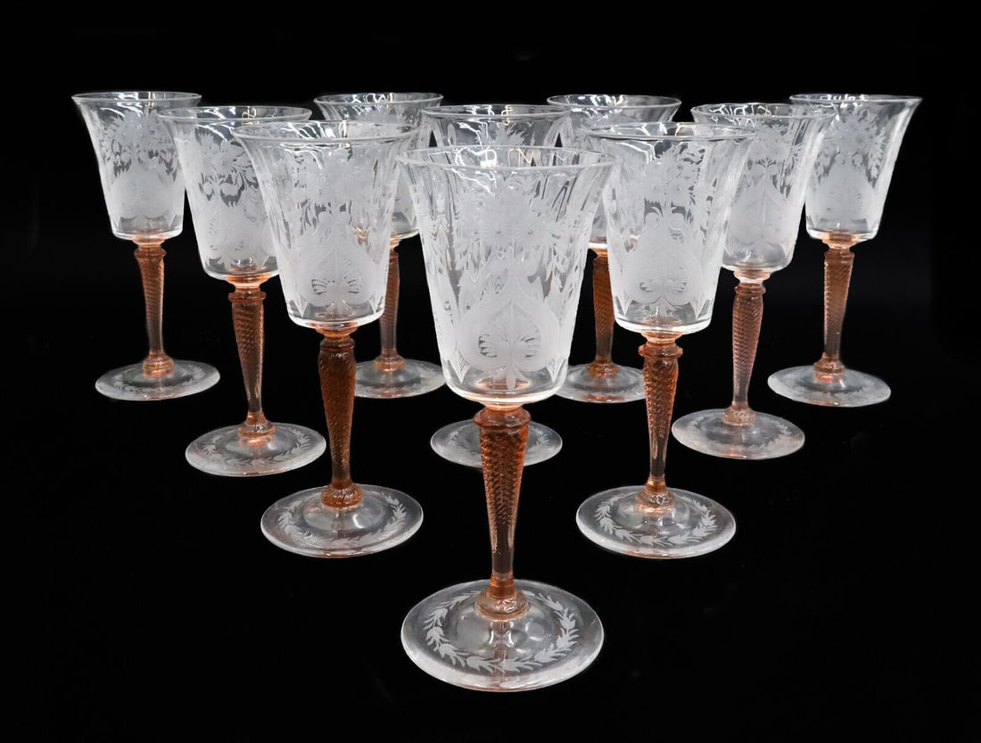 10 Steuben Acid Etched Glass White Wine Goblets in Van Dyke Leaves and Flowers: 10 Steuben acid etched glass white wine goblets in Van Dyke. Coral orange twisted stems with acid etched leaves and flowers to bowl and round base. Acid etched Steuben mark to pontil underside. Weight