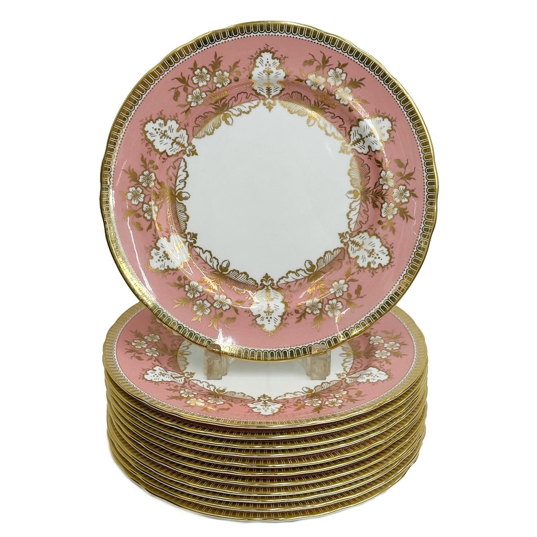12 Aynsley England Porcelain 10.5 in Dinner Plates 8089: 12 Aynsley England Porcelain Dinner Plates. A salmon pink ground decorated with gilt accents. Underside marked Aynsley England bone China 8089 Weight: Approx. 17 lbs Measurements: Approx. 10.5 inches