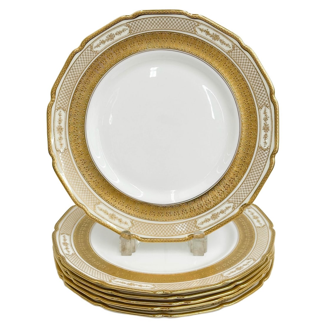 6 Royal Doulton England Gilt Porcelain Dinner Plates circa 1914: 6 Royal Doulton England Gilt Porcelain Dinner Plates. Gilt floral decoration to the rim. Three plates with magenta Royal Doulton mark, three plates with green Royal Doulton mark. Impressed date marks