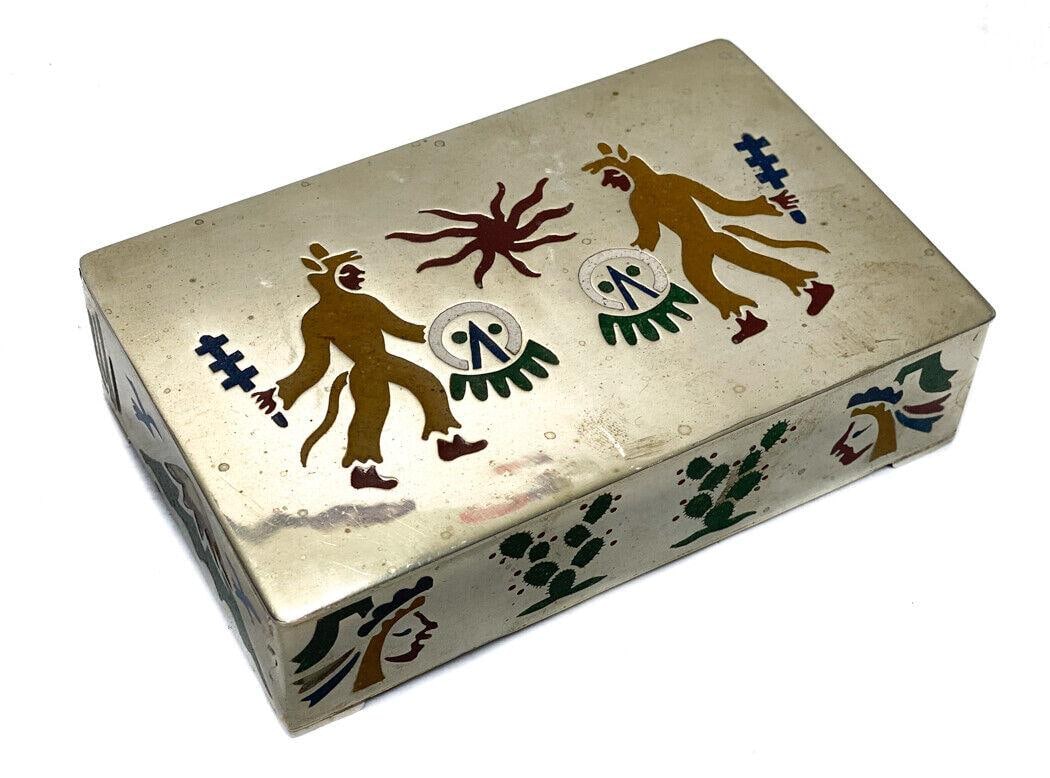 Mexico Alpaca Metal and Stone Inlaid Box, Warrior Scene. Wood Lining: Mexico Alpaca metal and lapis and malchite stone inlaid box. The lid of the box depicts a two figures in the midst of battle. The sides with mountainous, cactus, and bird figures. Wood lining to the i