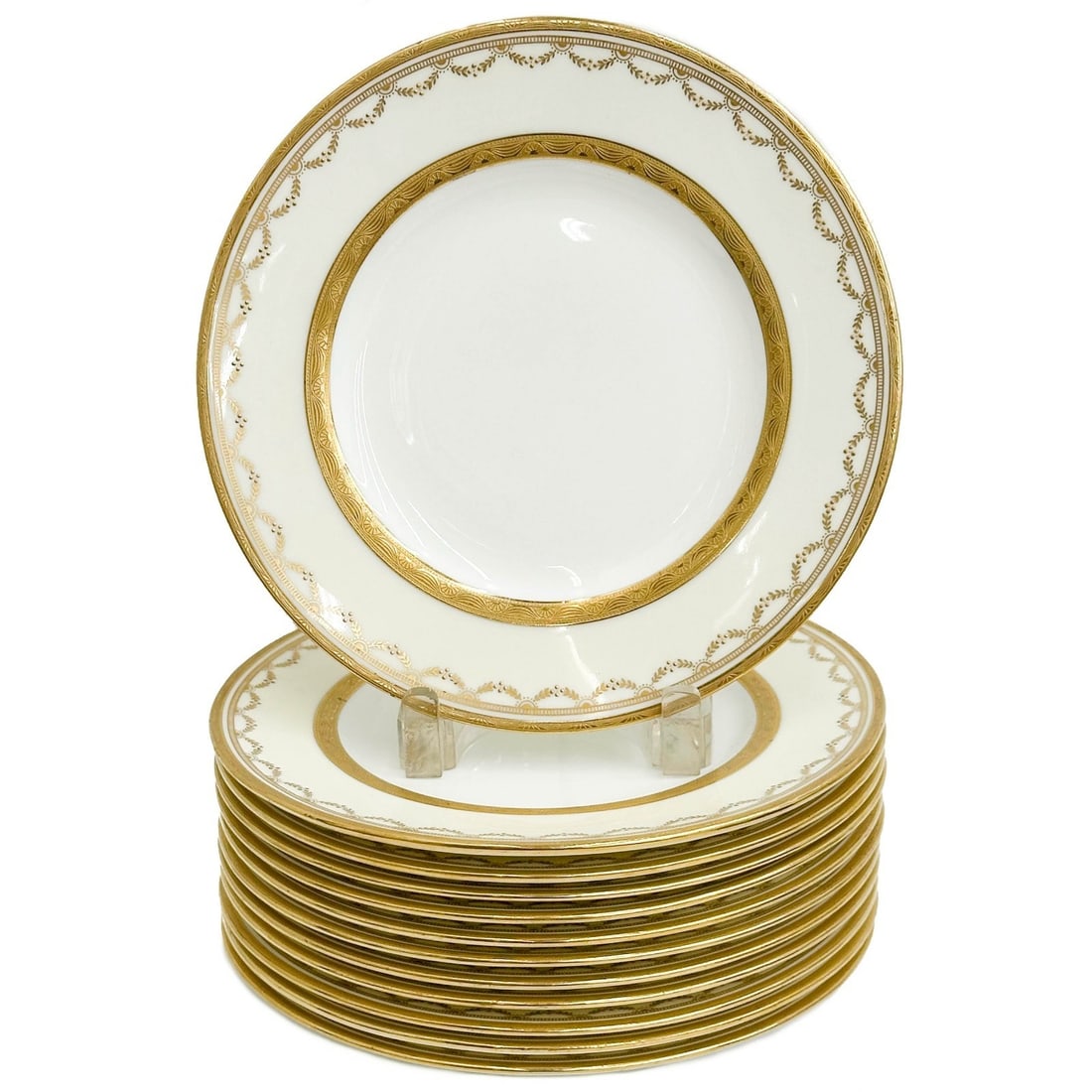 12 Minton England Gilt Porcelain 9 inch Dessert Plates 1919: 12 Minton England Gilt Porcelain Dessert Plates. Gilt floral garland decoration to the edge. Underside marked Minton England with retailer's marks, impressed date code for 1919 Weight: Approx. 12 lbs