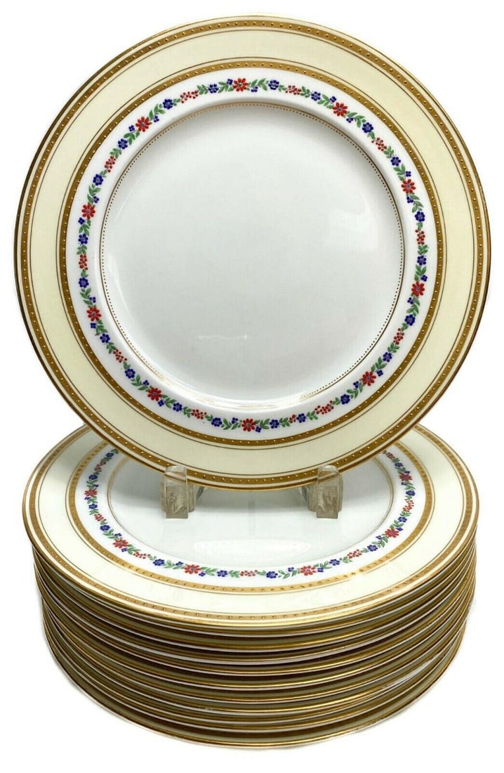 12 English George Jones Crescent Dinner Plates with Enamel Flower Band c1920: 12 George Jones & Sons Crescent dinner plates with cream colored ground and colorful enamel floral band and gilt band around rim. George Jones Crescent mark to underside. Weight Approx. 16 lbs Measure