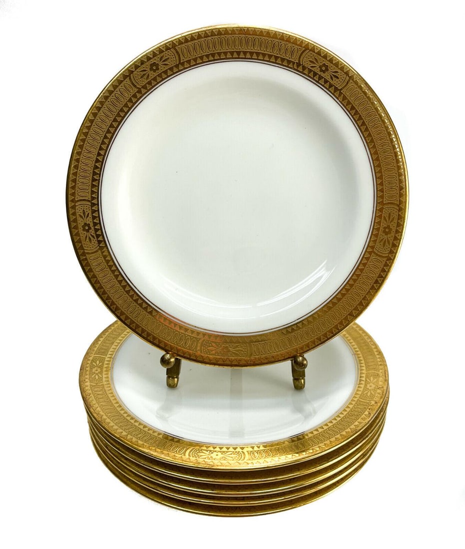 6 Cauldon Brown-Westhead Moore & Co. England Porcelain Bread Plates: 6 Cauldon Brown-Westhead Moore & Co. England porcelain bread plates. Gilt rims with embossed florals and geometric shapes. Cauldon marks to the underside. Weight: Approx. 2 lbs Measurements: Approx. 6