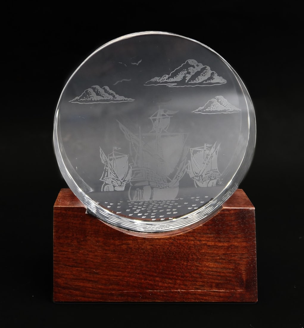 Steuben Crystal Art Glass Voyage of Columbus Paperweight by David Dowler #8642: Steuben Crystal Art Glass Voyage of Columbus paperweight by David Dowler #8642. Depicts the Pinta, Nina, and Santa Maria. With wooden base. Signed Steuben to edge. Weight: Approx. 1 lb Measurements: A
