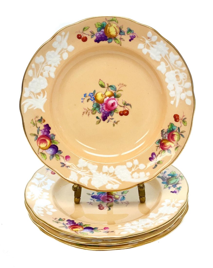 5 Copeland Spode for Tiffany & Co. Porcelain Bread Butter Plates, circa 1900: 5 Copeland Spode England for Tiffany & Co. porcelain bread and butter plates, circa 1900. Floral and fruit bouquets to the center and around the scalloped rim of the peach colored porcelain ground. Co