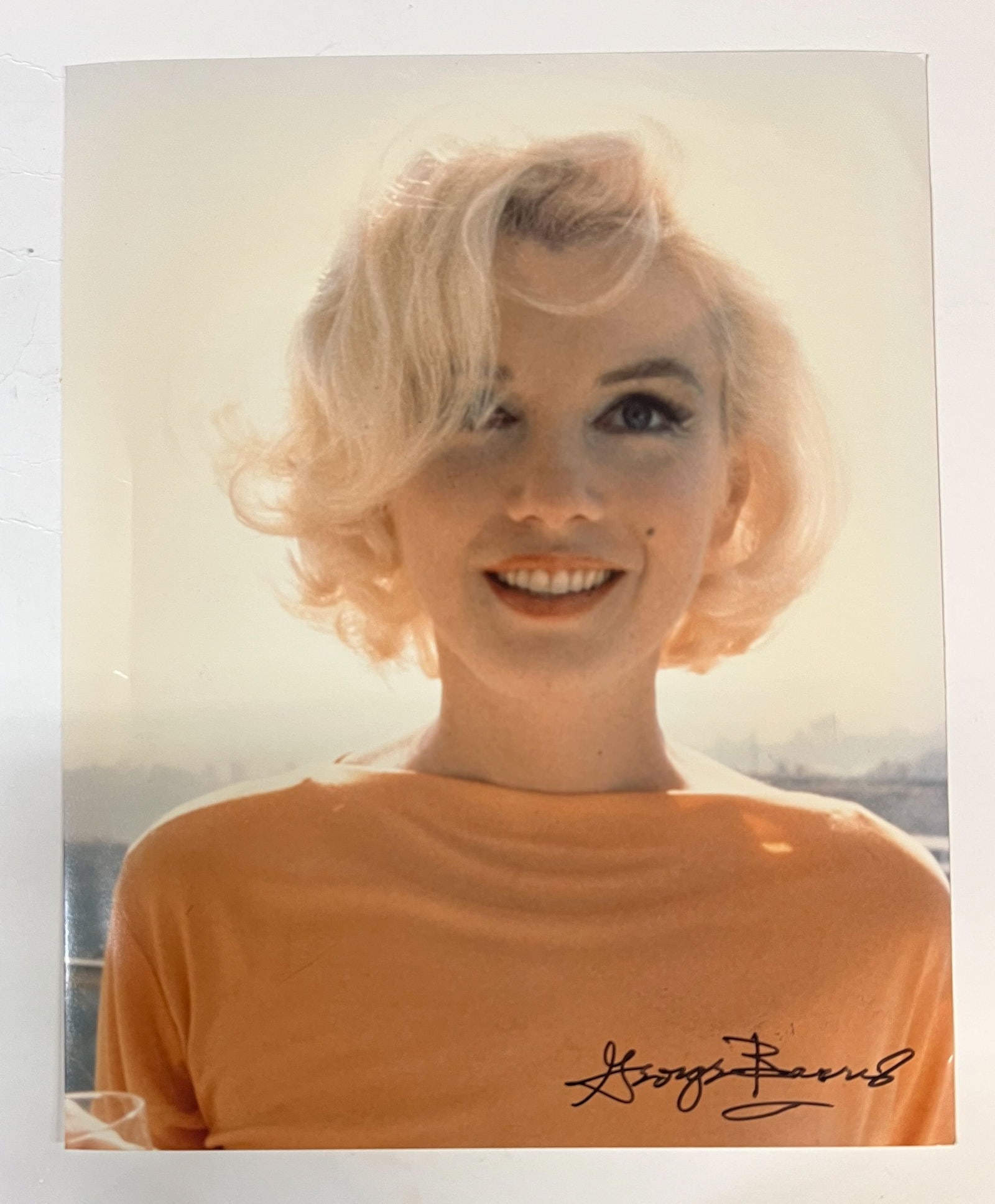 Color Photograph Marilyn Monroe by George Barris: A limited edition George Barris color photograph of Marilyn Monroe. Signed by George Barris in marker (lower left). Stamped and numbered on reverse. Marilyn Monroe at her home in 1962, a close up. Thi