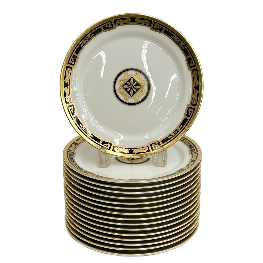 16 Cartier France La Maison de L'Art Deco Panther Gilt Porcelain Dessert Plates: 16 Cartier France La Maison de L'Art Deco Gilt Porcelain Dessert Plates. A white ground with gilt decoration to rim and center of panthers with blue enamel jewel accents. Underside marked Cartier La M