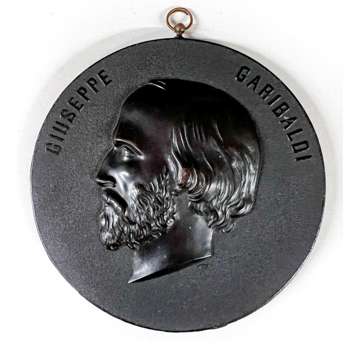 19th Century Bois Durci Medallion Giuseppe Garibaldi: 19th Century Bois Durci Medallion Giuseppe Garibaldi. Round shape with image in bas relief. Marked "Bois Durci" on reverse Measurements: Approx. 4.5 inches diameter Condition: Very good condition, sma