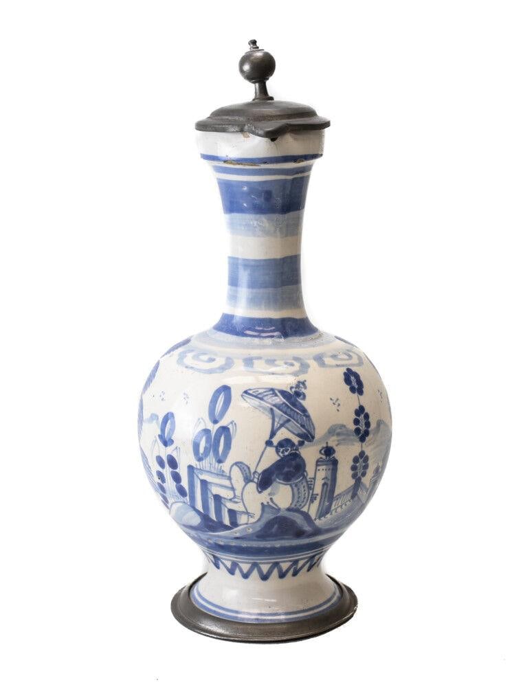 18th Century Pewter mounted Continental Faience Ewer Jug blue and white: 18th Century Pewter-mounted Continental Faience Ewer Jug, painted blue and white chinoisorie style landscape with figure holding parasol. No hallmarks, or makers marks. From the estate of Hans Cohn. 2