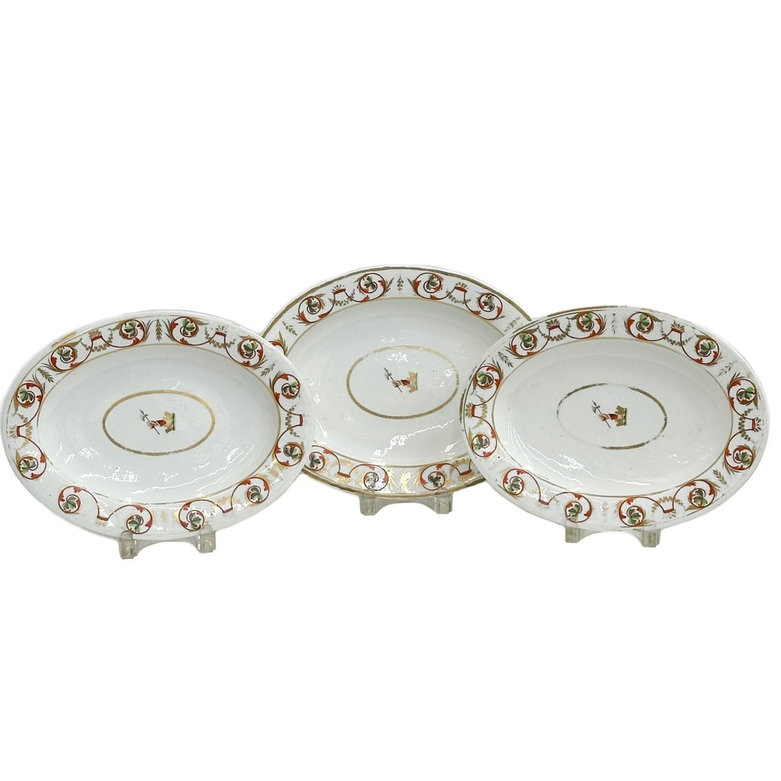 3pc Royal Crown Derby Hand Painted Armorial Porcelain Oval Serving Dishes c1810: 3 Royal Crown Derby Hand Painted Porcelain oval serving dishes or Platters, circa 1810. A white ground, decorated to the edge with red green and gilt foliate designs. Hand painted armorial arm with cr