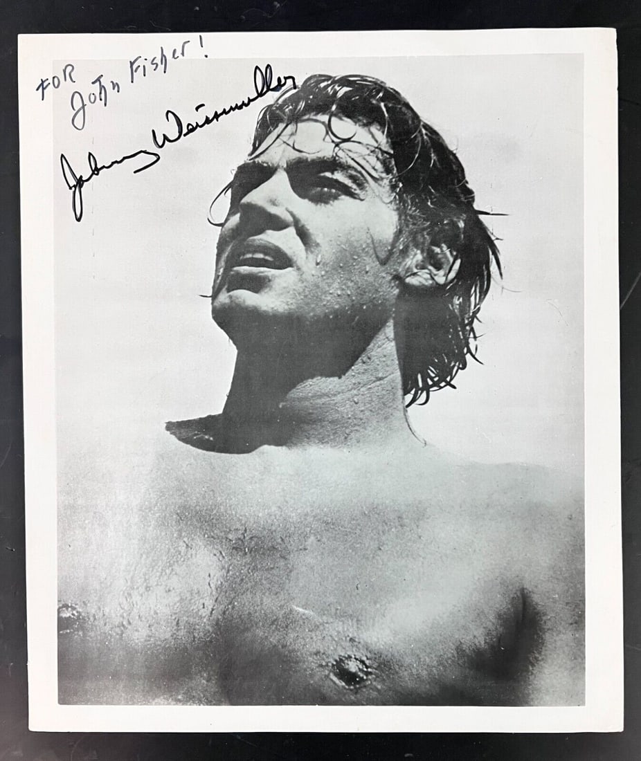 Johnny Weissmuller autograph Tarzan Photograph: Johnny Weissmuller (1904-1984) Black and White photograph, autographed, inscribed 'For John Fisher!' Hungarian-born ethnic German American Olympic swimmer, water polo player and actor. He was known fo