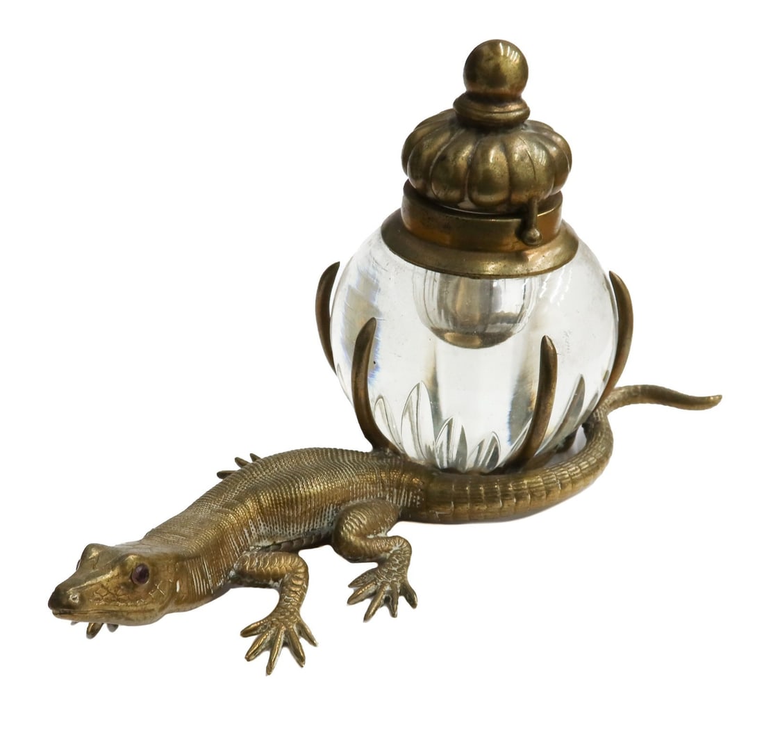 French Gilt Bronze and Ruby Rock Crystal Lizard Inkwell circa 1920: French Gilt Bronze and Ruby Rock Crystal Lizard Inkwell circa 1920. Figural gilt bronze lizard with applied ruby eyes. The tail wrapped around a rock crystal class inkwell. Weight: Approx. 2 lbs Measu