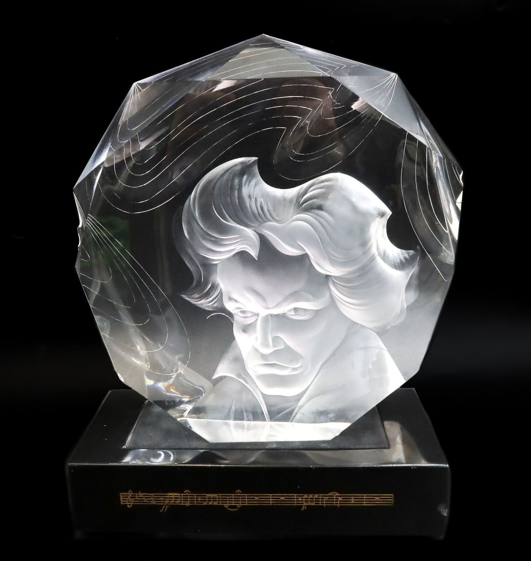 Steuben Art Glass Sculpture Beethoven by Donald Pollard with Lightbase and Folio: Steuben Art Glass Sculpture "Beethoven" by Donald Pollard. Depicts an engraved portrait of Beethoven after the portrait by Robert Ziering. Signed Steuben to underside edge. With orignal leather bound