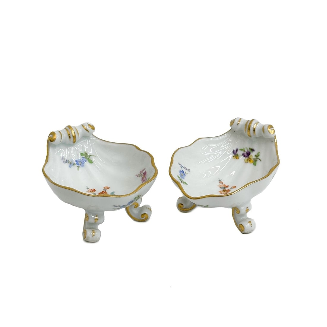Pair Meissen Germany Shell Form Open Salt Cellars Florals c1900: Pair Meissen Germany Shell Form Open Salt Cellars, circa 1900. Florals throughout, scrolled feet. Meissen crossed swords mark to underside. Weight: Approx. .5 lb Measurements: Approx. 3.125 inches x 2