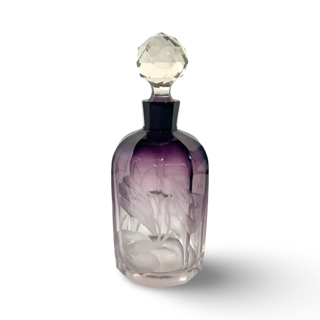 Moser Art Glass Perfume Bottle amethyst intaglio: Moser Art Glass Perfume Bottle, intaglio flowers on Amethyst fade to clear glass. Fluted sides, faceted dome stopper Measurements: Approx. 5.75 inches total height x 2.25 inches diameterCondition: Ver