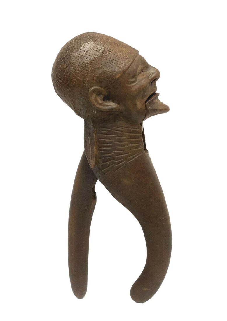 Continental Wooden Figural Carved Nut Cracker, 19th Century: Continental wooden figural carved nut cracker, 19th Century. The head of the nut cracker depicts an elderly man's face. Continental, but possibly German Weight: Approx. 1 lbs Measurements: Approx. 8.2