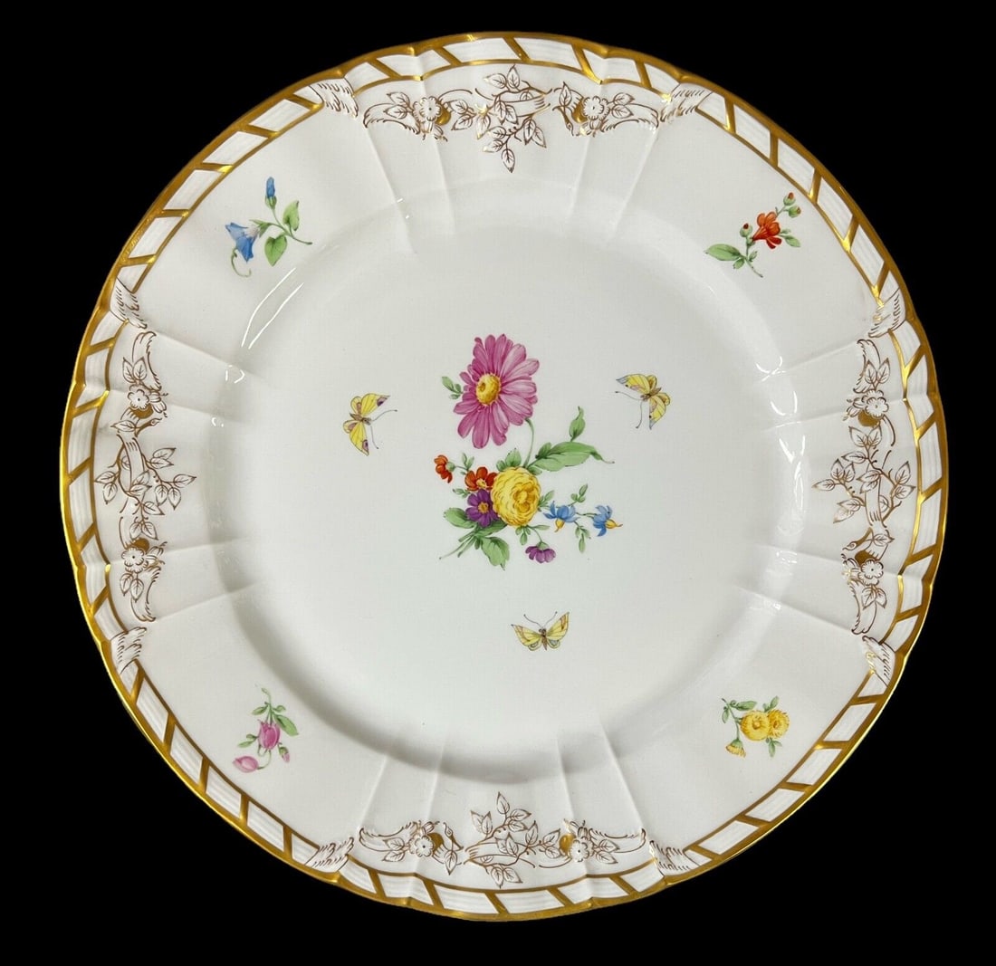 KPM Porcelain Plate hand painted florals 19th Century: KPM Porcelain Plate, hand painted florals and butterflies, embossed and gilt floral rim with gilt trim, makers mark on underside, with wall hanger on back. 19th Century 2.2lb Measurements: Approx. 10.