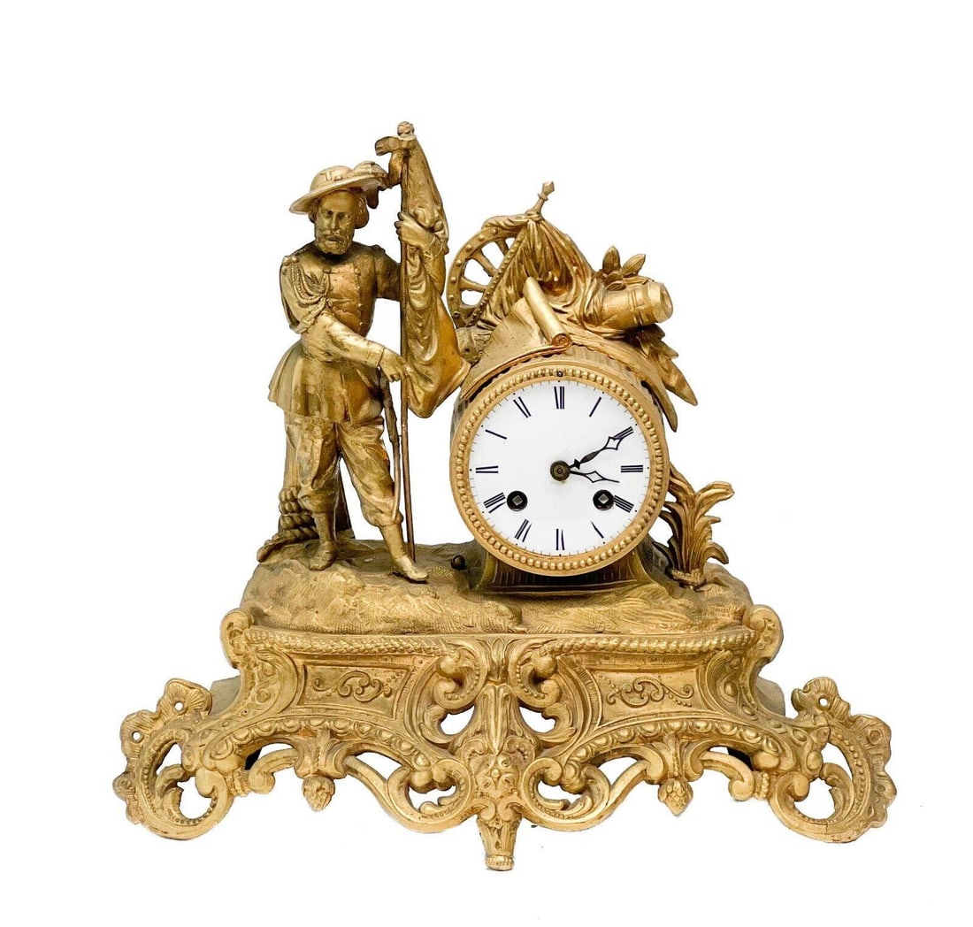 European Gilt Bronze and Metal Mantel Clock Figural Sailor late 19th cen: European gilt bronze and metal mantel clock, late 19th century. Sailor figure holding a flag, appears to be cast in bronze. Clock base possibly gilt metal with foliate feet. The back panel appears to