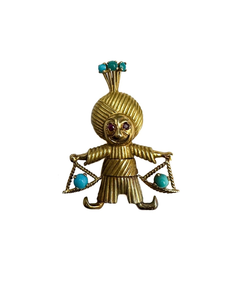 18k Yellow Gold Ruby Eyed and Turquoise Indian Raja Pin Brooch: 18k yellow Indian raja pin brooch. Ruby inset eyes with turquoise to scales and top of turban. Tests for 18k gold. Weight: Approx. 8.67 grams Measurements: Approx. 1.5 inches length Condition: Great c