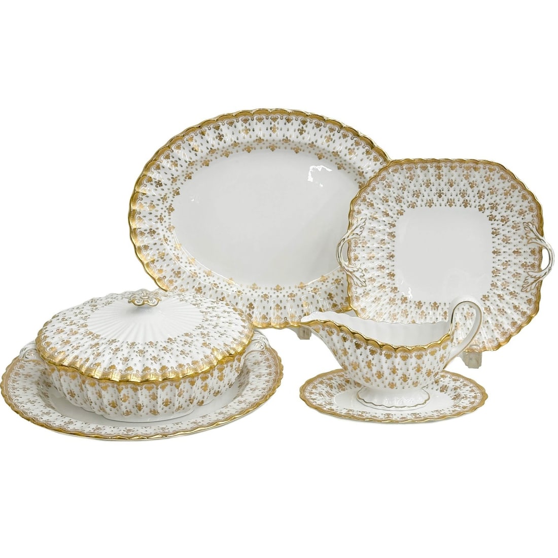 6pc Spode England Gilt Porcelain Serving Pieces in Fleur de Lys: Spode England Gilt Porcelain Serving Pieces in Fleur de Lys. A white ground decorated with gilt fleur-de-lys throughout. Set includes oval serving tray, square handled cake plate, lidded tureen with u