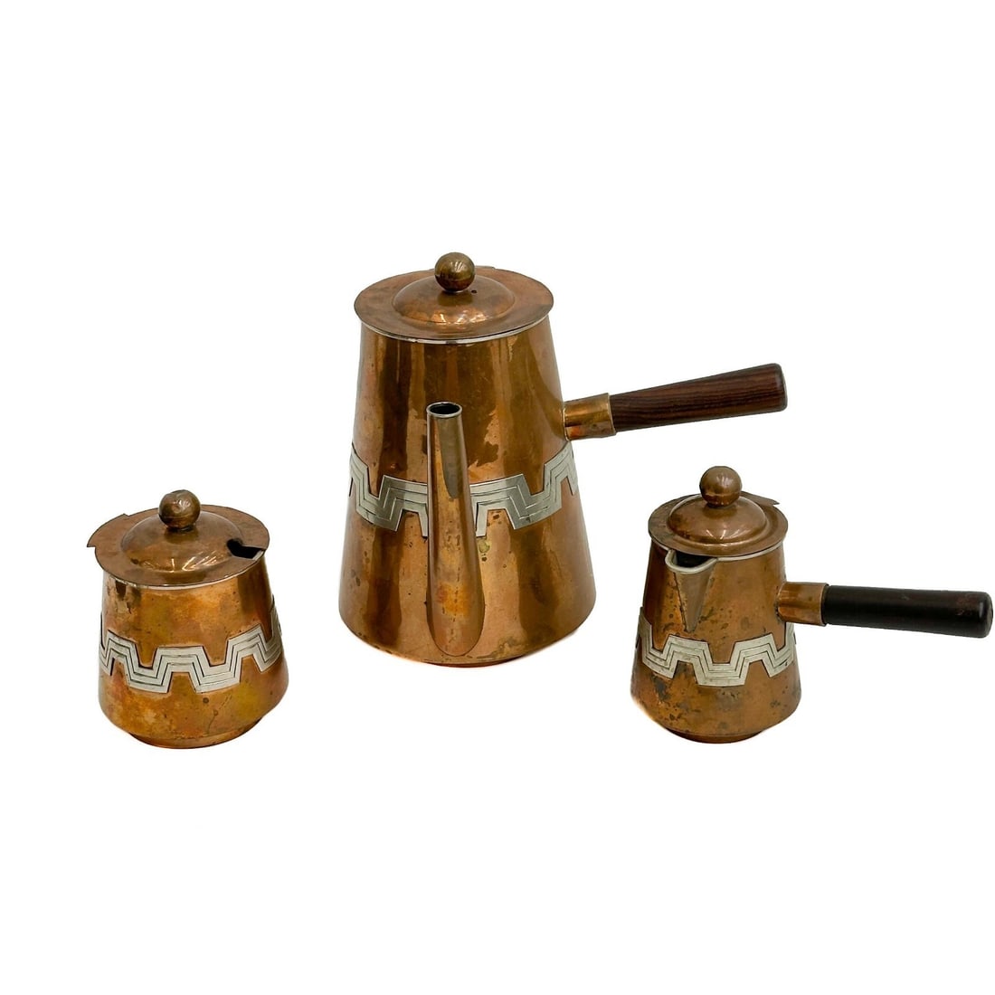Cobre Mexico Applied Silver Copper Tea Coffee Set: Cobre Mexico Applied Silver Copper Tea Set. Set includes tea/coffee pot, creamer, sugar. Underside marked Cobre Mexico Weight: Approx. 3 lb Measurements: Approx. Pot: 7.75 inches x 6.5 inches x 7.5 in