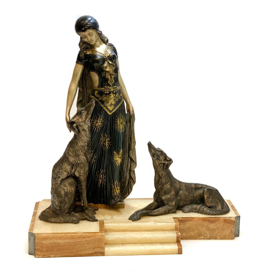 Georges Van De Voorde Art Deco Patinated & Silvered Sculpture of Maiden & Borzoi: Georges Van de Voorde (Belgian 1878-1970) French Art Deco patinated & silvered metal sculpture. The sculpture depicts a maiden in a pleated black and gold dress petting her dogs. On marble and onyx ba