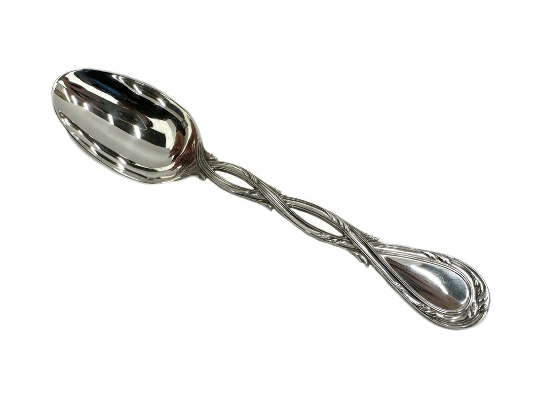 Puiforcat France Sterling Silver Teaspoon in Royal: Puiforcat France sterling silver teaspoon in Royal. Intertwined handle. Puiforcat hallmarks to the bowl of spoon. Weight: Approx. 1.388 ozt Measurements: Approx. 5.875 inches length Condition: Great c
